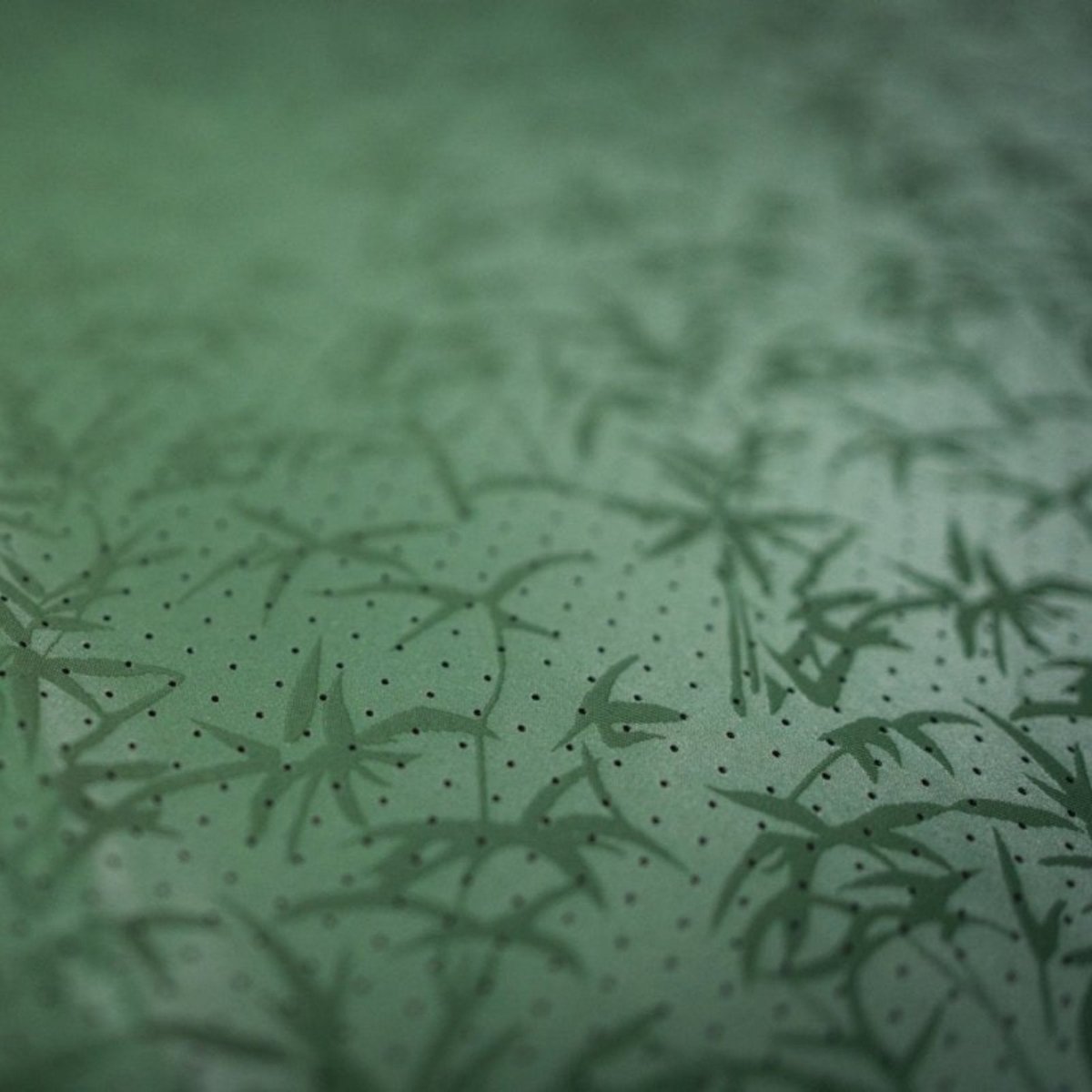 A close up of the green Grounded Kiwi Mats forest print.