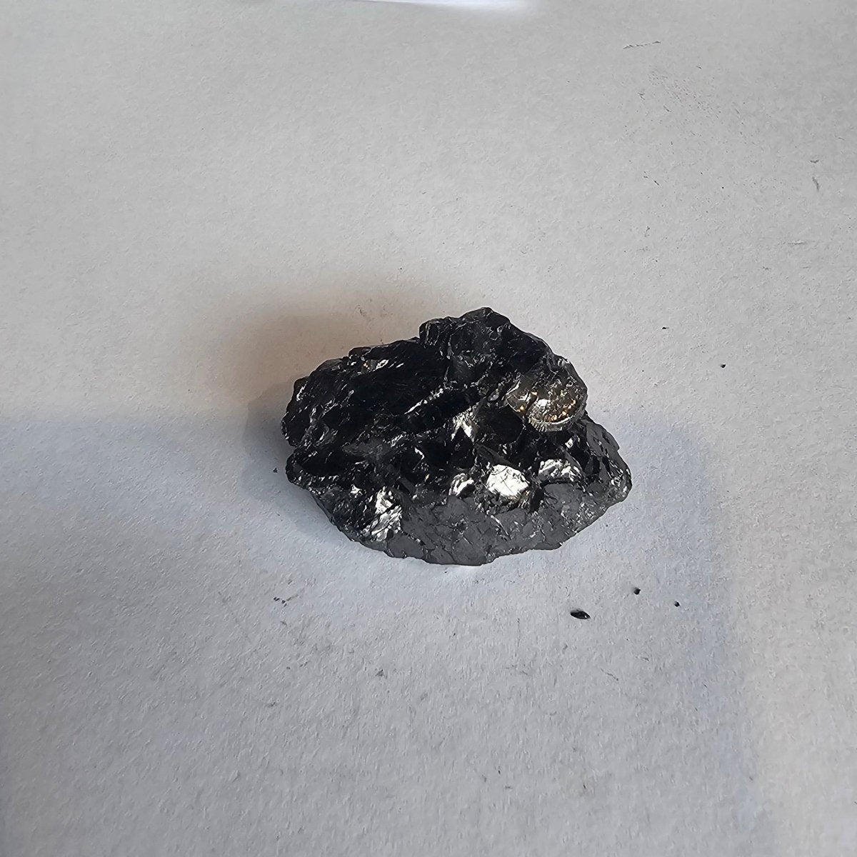 Shungite Crystal: Rare One - Piece Nugget - Abi Gamin (India) - GroundedKiwi.nz air travelcarchunk