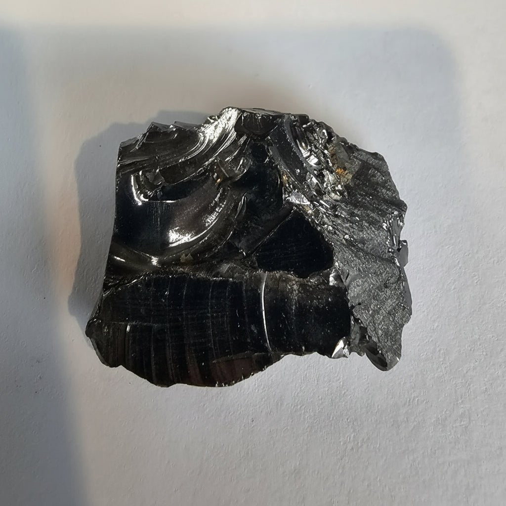Shungite Crystal: Rare One - Piece Nugget - Mount Fuji - GroundedKiwi.nz air travelcarchunk