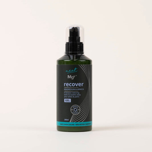 200ml dark green pump bottle of Mg+ magnesium and arnica gel on a plain cream background