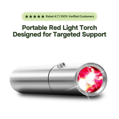 Portable Grounded Kiwi red light therapy torch in brushed metal, lens glowing red on white background