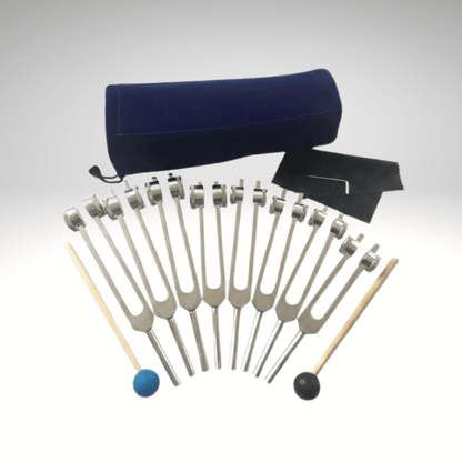 8 piece tuning forks on a white background