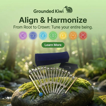 chakra tuning fork set sitting on a rock in a natural background