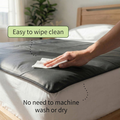 image shoing a hand wiping the grounding mat down with a cloth