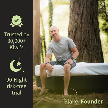 Man sitting on a mattress outdoors with promotional text on the side.