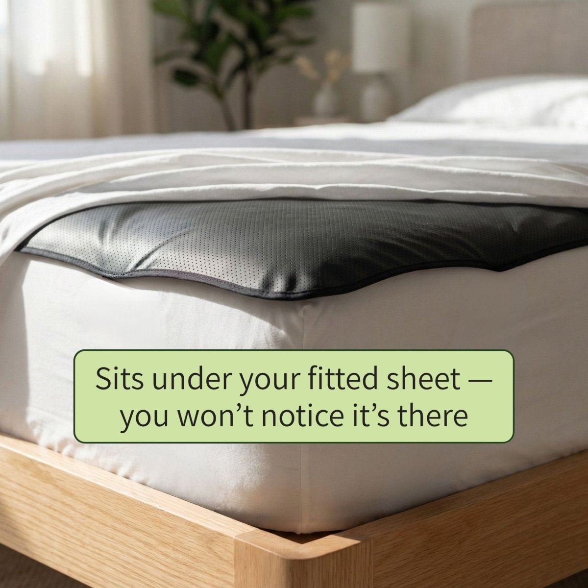 grounding mat close up on bed with text saying "fits under your sheet"