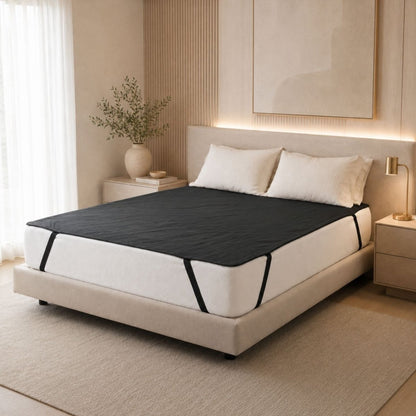 Grounded Kiwi Grounding Mat for your bed to enhance deep sleep. This Queen size earthing mat is placed on top of a mattress in a nice modern bedroom setting. 