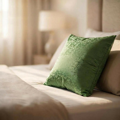 Green grounding pillow on a bed with soft lighting