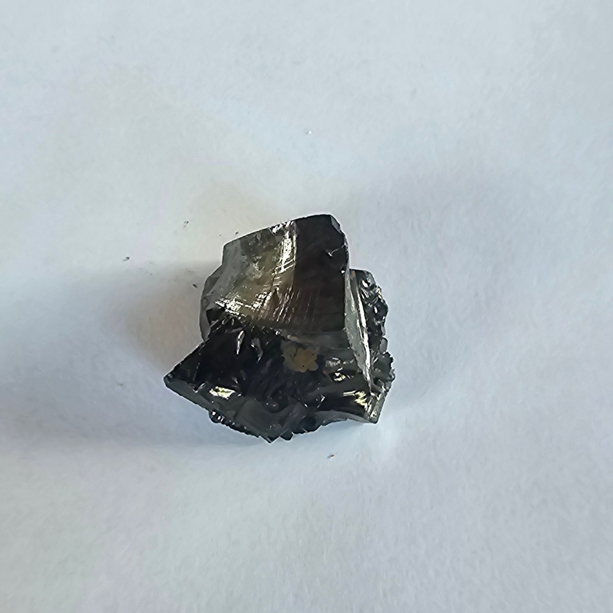 Mount Rainier elite shungite nugget, 10.8g: compact chunk with a smooth sloping bronze-sheened top facet