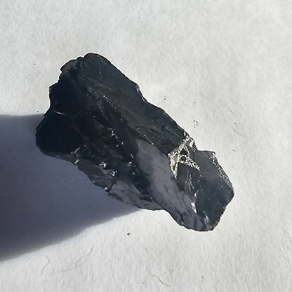 Mount Olympus elite shungite nugget, 20.2g: long angled slab with a bright silvery vein across one end