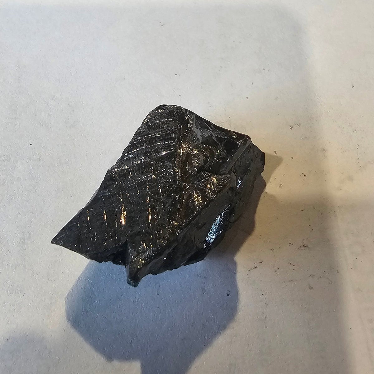Shungite Crystal: Rare One-Piece Nugget - Maunga Roa (Cook Islands) - GroundedKiwi.nz air travelcarchunk