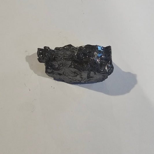 Shungite Crystal: Rare One-Piece Nugget - Mount McKinley - GroundedKiwi.nz air travelcarchunk