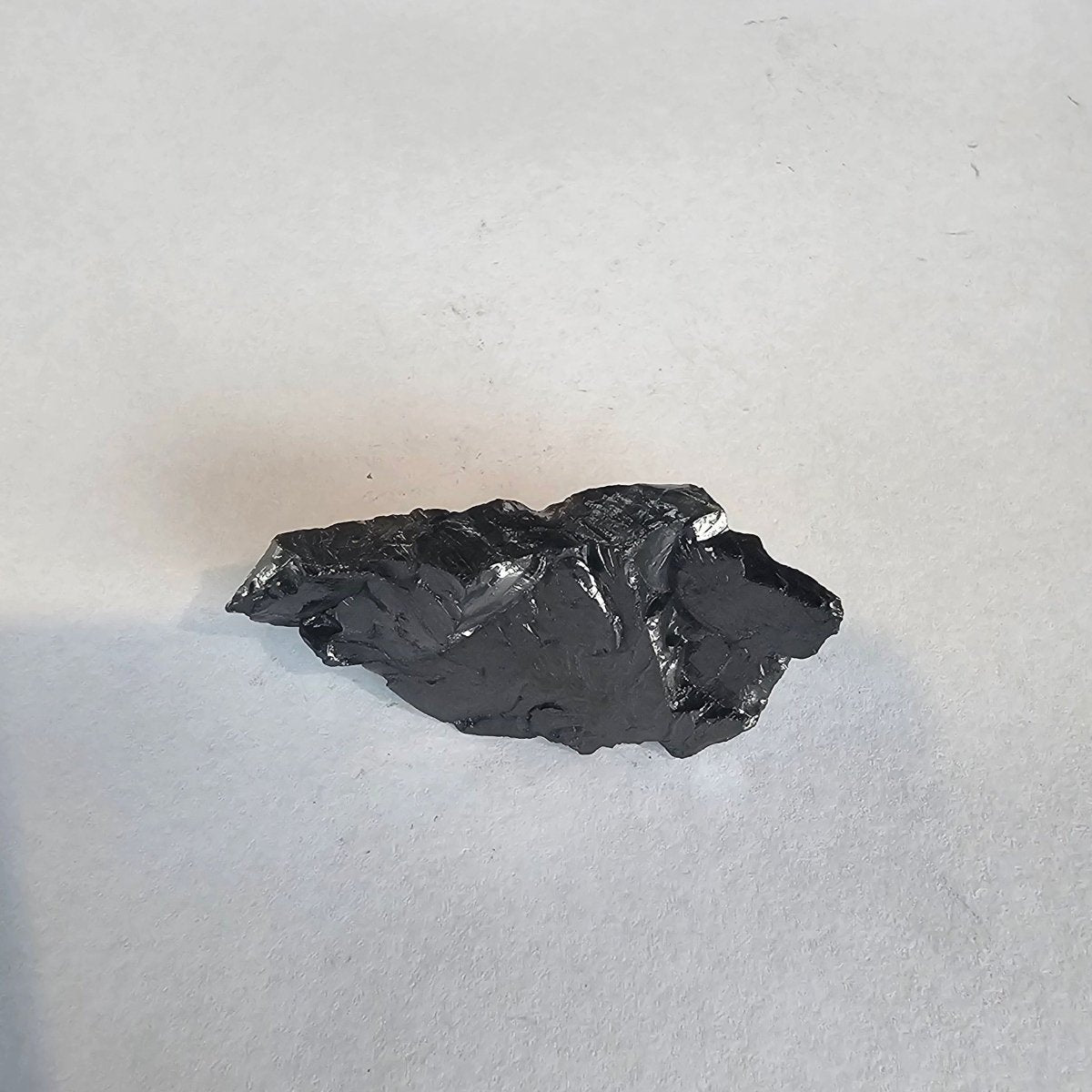 Shungite Crystal: Rare One - Piece Nugget - Mount Rainier - GroundedKiwi.nz air travelcarchunk
