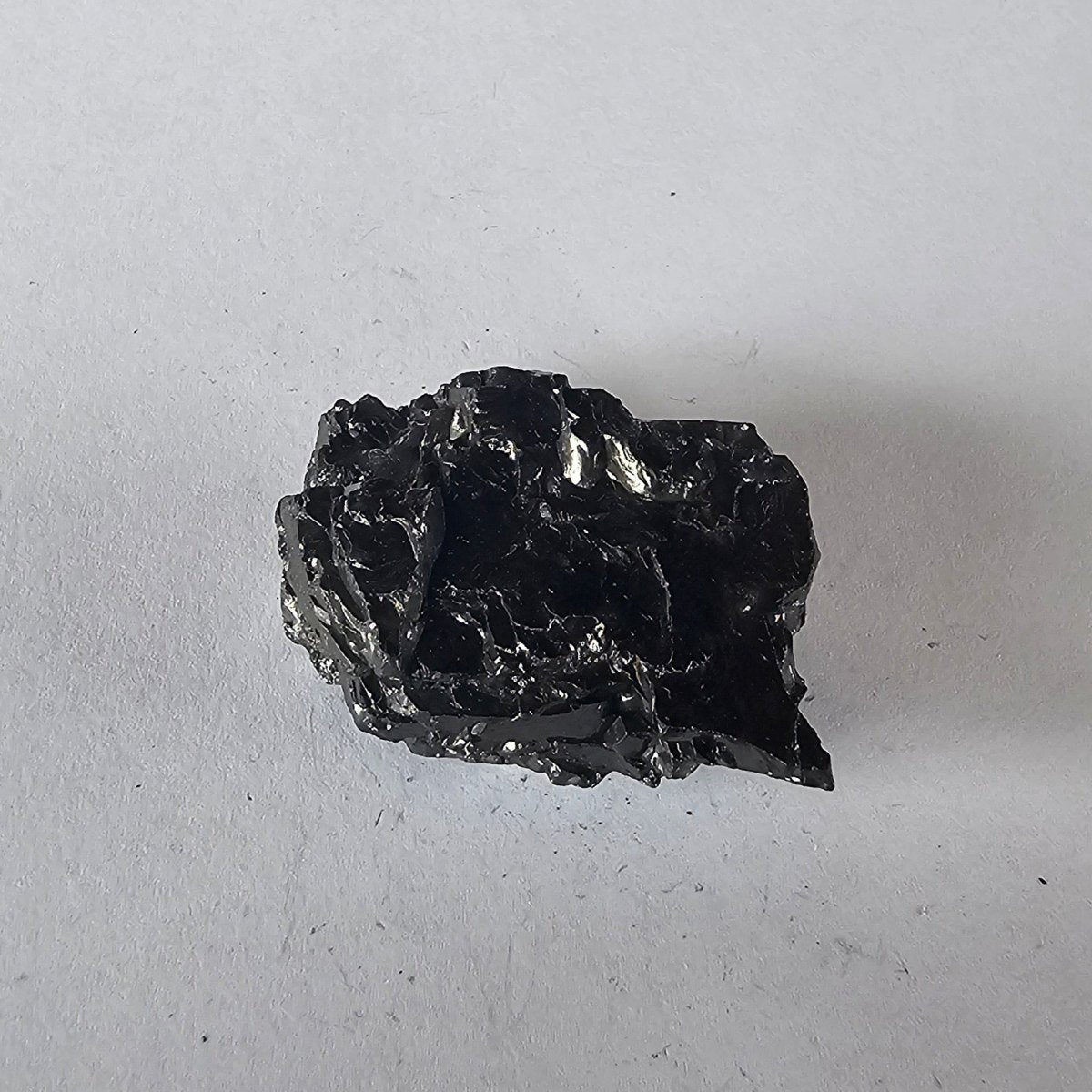 Shungite Crystal: Rare One - Piece Nugget - Tongariro (New Zealand) - GroundedKiwi.nz air travelcarchunk
