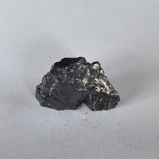 Shungite Crystal: Rare One - Piece Nugget - Whakaari (New Zealand) - GroundedKiwi.nz air travelcarchunk