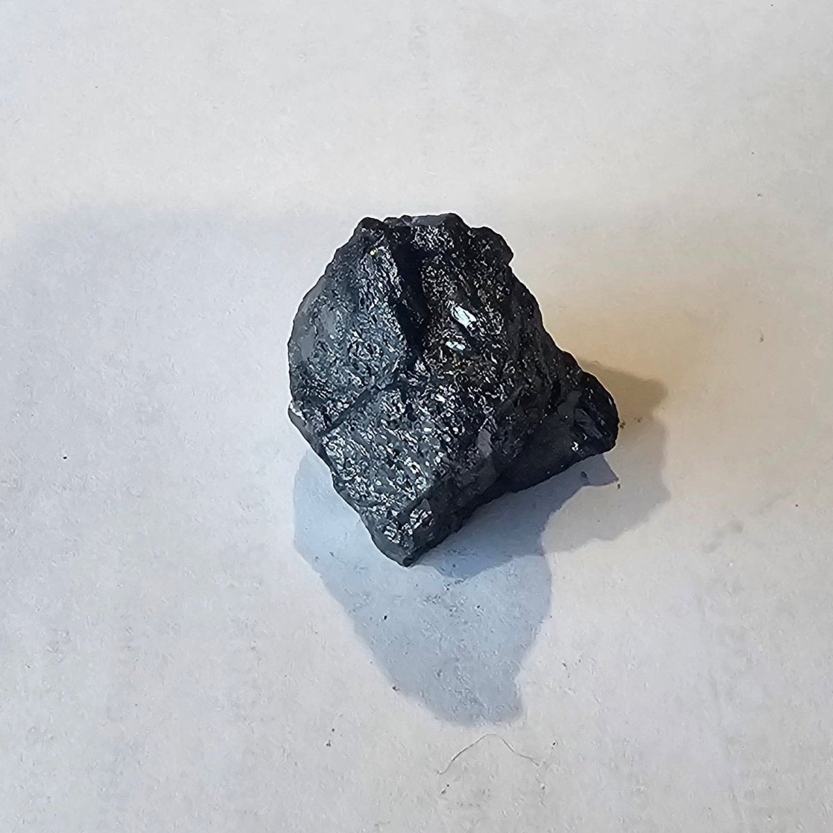 Shungite: Rare One-Piece Nugget - Mount Hicks - GroundedKiwi.nz air travelcarchunk