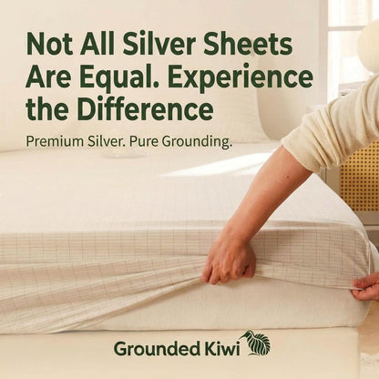 silver fiber fitted earthing sheet being fitted onto a bed
