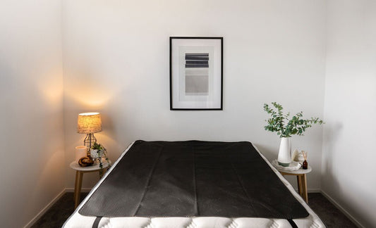 Earthing Mat on a king sized bed. Showing how to set up your earthing mat nz